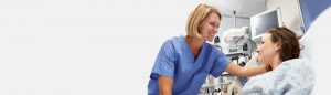 health-care-worker-smiling-at-patient-in-hospital-setting-image